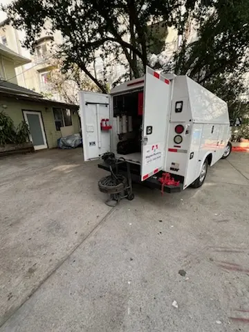 Magnet Plumbing service vehicle on-site for Grease Trap Cleaning in Historic Biltmore Village